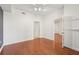 Bedroom featuring wood floors, multiple doors and doorways, and a closet with shelves at 1101 Juniper Ne St # 415, Atlanta, GA 30309