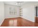 Bedroom featuring wood floors, a ceiling fan, a window and a closet with built-in wood shelving at 1101 Juniper Ne St # 415, Atlanta, GA 30309