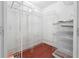Spacious closet with custom white racks and shelves on a wooden floor provides ample storage at 1101 Juniper Ne St # 415, Atlanta, GA 30309