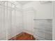 Walk-in closet featuring wood floors and white wire shelving for ample storage at 1101 Juniper Ne St # 415, Atlanta, GA 30309
