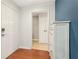 Foyer featuring hardwood floors, white walls, and a storage cabinet at 1101 Juniper Ne St # 415, Atlanta, GA 30309