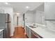 The kitchen features stainless steel appliances, gray cabinets, marble backsplash, and a stainless steel sink at 1101 Juniper Ne St # 415, Atlanta, GA 30309
