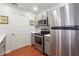 Modern kitchen with stainless steel appliances, white countertops, and gray cabinets at 1101 Juniper Ne St # 415, Atlanta, GA 30309