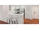 Kitchen with white quartz countertops, stainless steel appliances, and modern bar stools at 1101 Juniper Ne St # 415, Atlanta, GA 30309