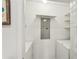 Laundry room with white washer and dryer and wire shelving at 1101 Juniper Ne St # 415, Atlanta, GA 30309