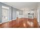 Living room features hardwood floors, neutral paint, and a door leading to a balcony at 1101 Juniper Ne St # 415, Atlanta, GA 30309