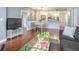 Inviting living room with hardwood floors, plush seating, and a clear view of the dining area and kitchen at 1101 Juniper Ne St # 415, Atlanta, GA 30309