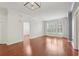 Bright living room featuring hardwood floors, large windows, and modern lighting fixture at 1101 Juniper Ne St # 415, Atlanta, GA 30309