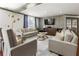 Relaxing living room with sofas, chairs, and a large-screen television at 1101 Juniper Ne St # 415, Atlanta, GA 30309