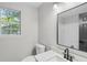 Bathroom with granite countertop and modern mirror at 175 Cypress Dr, Covington, GA 30016