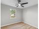 Bright bedroom with window and light colored wood floors at 175 Cypress Dr, Covington, GA 30016