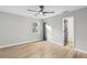 Large bedroom with light hardwood floors and neutral paint at 175 Cypress Dr, Covington, GA 30016