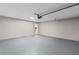 A spacious garage with gray floors and modern lighting at 175 Cypress Dr, Covington, GA 30016