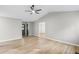 An open-concept living room featuring high ceilings, ceiling fan and a seamless transition to adjacent spaces at 175 Cypress Dr, Covington, GA 30016