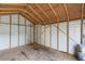 Interior view of the shed with exposed rafters and walls at 175 Cypress Dr, Covington, GA 30016