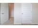 Bedroom with a white door and neutral-toned carpet at 2042 Clay Rd, Snellville, GA 30078