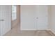 Bedroom with a white door and window, and neutral-toned carpet at 2042 Clay Rd, Snellville, GA 30078