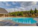 Resort-style community pool and lounge area with ample seating and well maintained landscaping at 2042 Clay Rd, Snellville, GA 30078
