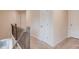 Upstairs hallway with neutral-toned carpet, white walls and doors at 2042 Clay Rd, Snellville, GA 30078