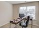 Bright carpeted office space with window, computer, desk and office chair, and ample workspace at 2042 Clay Rd, Snellville, GA 30078