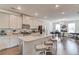 Bright kitchen featuring an island with granite countertops, stainless steel appliances, hardwood floors, and recessed lighting at 2042 Clay Rd, Snellville, GA 30078