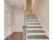 Hallway with carpeted staircase featuring wooden treads and white risers, leading to the upper level at 2042 Clay Rd, Snellville, GA 30078
