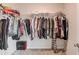 Walk-in closet with a shelf for hanging clothes at 2042 Clay Rd, Snellville, GA 30078