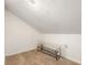 Unfinished attic featuring carpet flooring, slanted walls and lighting fixture at 3228 Clairmont North Ne # 3228-A, Brookhaven, GA 30329