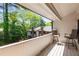 View from the spacious balcony with trees and building at 3228 Clairmont North Ne # 3228-A, Brookhaven, GA 30329