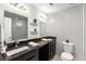 Modern bathroom with double vanity, patterned tile wall, and ample lighting at 3228 Clairmont North Ne # 3228-A, Brookhaven, GA 30329