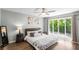 Inviting bedroom with a ceiling fan, wood floors, neutral decor and plenty of natural light at 3228 Clairmont North Ne # 3228-A, Brookhaven, GA 30329