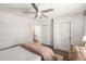 Neutral bedroom with ceiling fan, closet, desk area, and door at 3228 Clairmont North Ne # 3228-A, Brookhaven, GA 30329