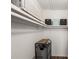 Organized closet with shelving, storage bins, and rolling laundry cart at 3228 Clairmont North Ne # 3228-A, Brookhaven, GA 30329