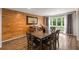 Charming dining area with wood floors, decorative wall, and views of the private backyard at 3228 Clairmont North Ne # 3228-A, Brookhaven, GA 30329