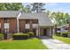 Charming townhome featuring brick accents, manicured lawn and convenient covered parking at 3228 Clairmont North Ne # 3228-A, Brookhaven, GA 30329
