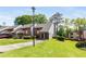Inviting townhome featuring manicured lawn, mature trees and convenient covered parking at 3228 Clairmont North Ne # 3228-A, Brookhaven, GA 30329