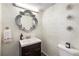 Stylish half bathroom with modern vanity and designer mirror at 3228 Clairmont North Ne # 3228-A, Brookhaven, GA 30329