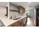 Well-lit kitchen featuring stainless appliances, modern countertops, and tile backsplash at 3228 Clairmont North Ne # 3228-A, Brookhaven, GA 30329