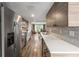 Modern kitchen with stainless steel appliances, updated countertops, and ample cabinet space at 3228 Clairmont North Ne # 3228-A, Brookhaven, GA 30329