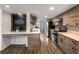 Stylish kitchen featuring stainless appliances, stone countertops, and welcome message at 3228 Clairmont North Ne # 3228-A, Brookhaven, GA 30329