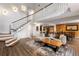 Open-concept living room with wood floors, white walls, and staircase leading to the second floor at 3228 Clairmont North Ne # 3228-A, Brookhaven, GA 30329