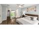 Cozy main bedroom featuring wood floors, ceiling fan, and stylish decor at 3228 Clairmont North Ne # 3228-A, Brookhaven, GA 30329