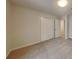 Bedroom with plush carpet, double closet, and a white door with wood trim at 6413 Swift Creek Dr, Lithonia, GA 30058