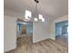 Elegant dining area with a stylish chandelier and beautiful hardwood flooring at 6413 Swift Creek Dr, Lithonia, GA 30058