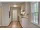 Functional kitchen with white cabinetry, a window view, and modern appliances at 6413 Swift Creek Dr, Lithonia, GA 30058