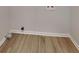 Neutral laundry area with light wood flooring and a hookup for the washer and dryer at 6413 Swift Creek Dr, Lithonia, GA 30058