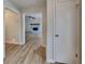 Inviting entryway leading to a spacious living room with a stone fireplace and hardwood flooring at 6413 Swift Creek Dr, Lithonia, GA 30058