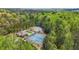 Aerial view showcasing community amenities, including a pool, tennis courts, and basketball court, surrounded by trees at 6917 Demeter Dr, Atlanta, GA 30349