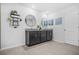 Bathroom featuring dual vanities with granite countertops, large mirrors, and tiled floors, perfect for a busy Gathering at 6917 Demeter Dr, Atlanta, GA 30349