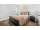 Cozy bedroom with neutral tones, plush carpeting, and natural light, creating a restful retreat at 6917 Demeter Dr, Atlanta, GA 30349